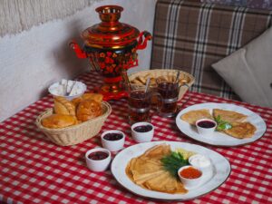 breakfast with pancakes on a red checked tablecloth